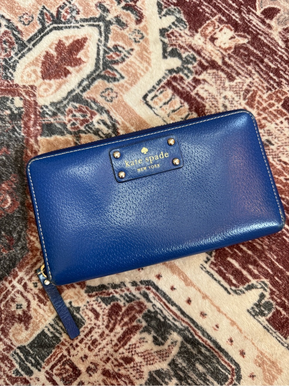 kate spade cobalt blue leather zip wallet with gold logo